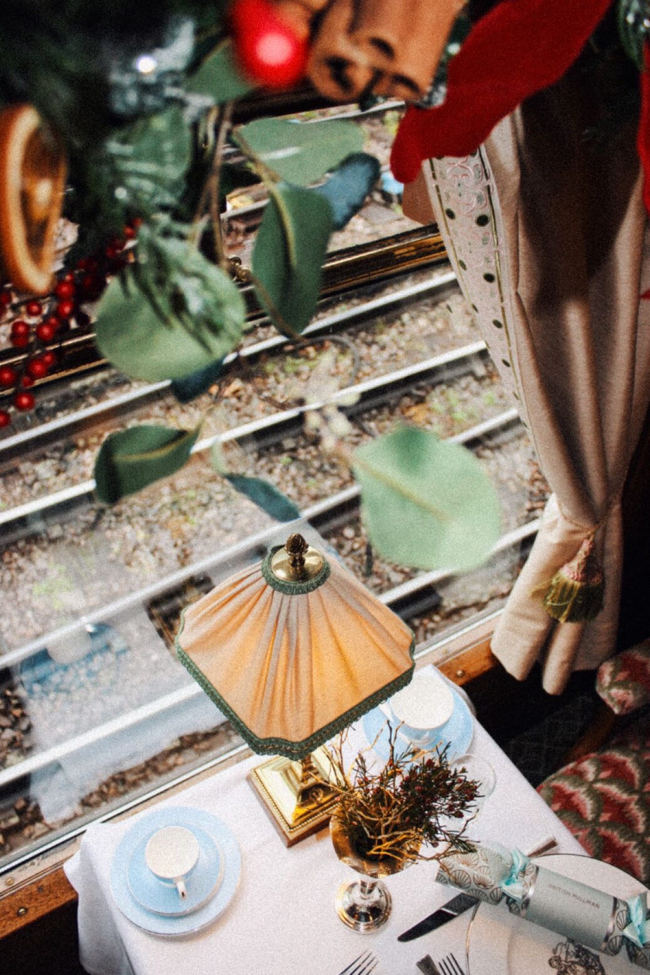 A vintage Pullman bar interior aboard British Pullman — Tayer & Elementary cocktails in the heritage 1920s bar setting.