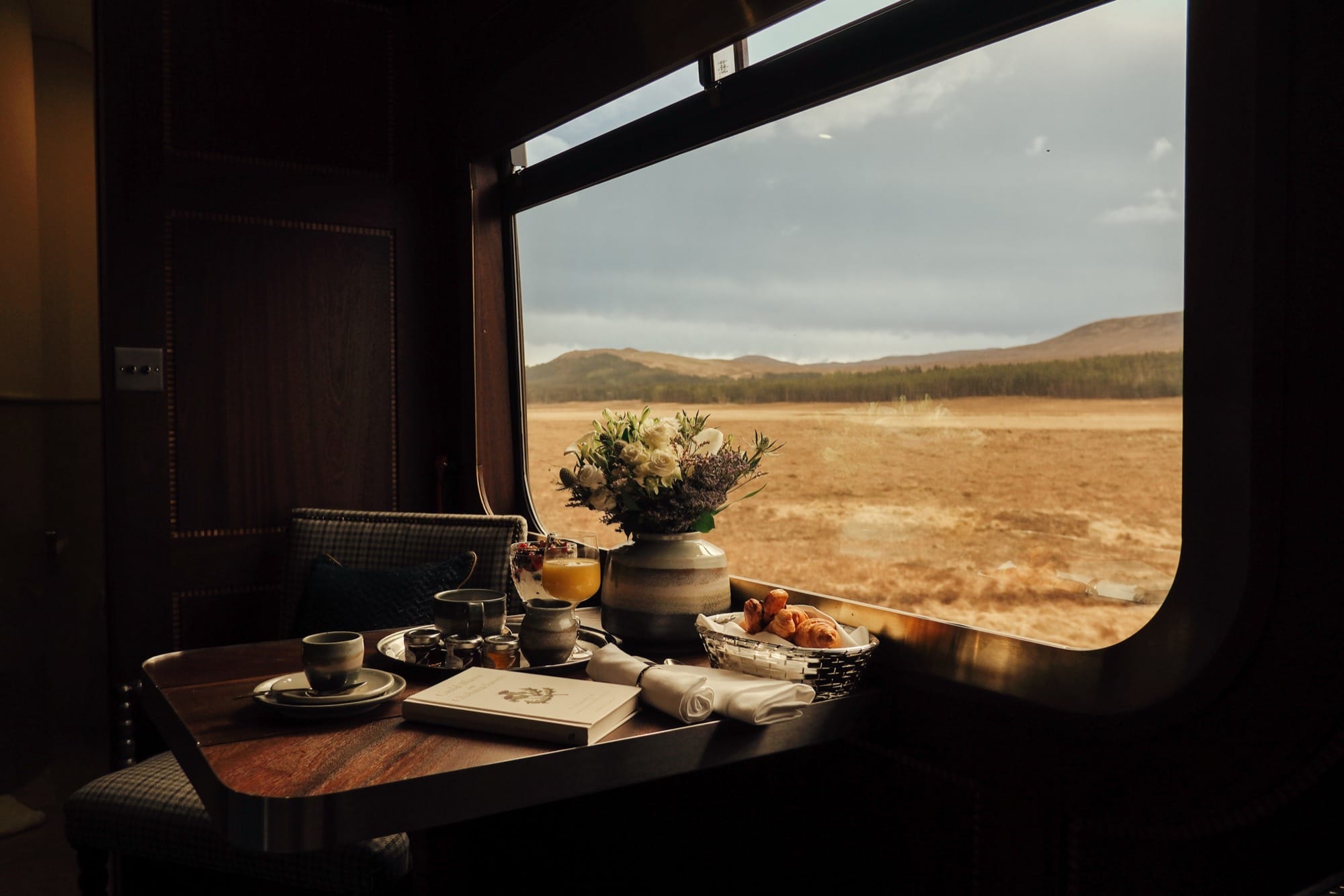 A cabin layout aboard Royal Scotsman — heritage detail, plush beds, and the en-suite layout.