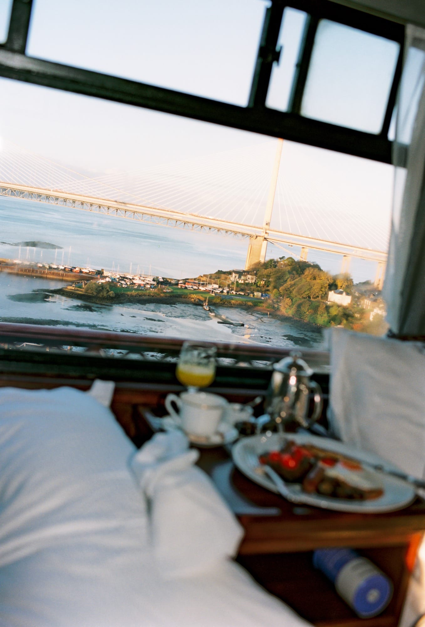 A Royal Scotsman cabin made up for the night — Edwardian linens and the rhythm of the train at rest.
