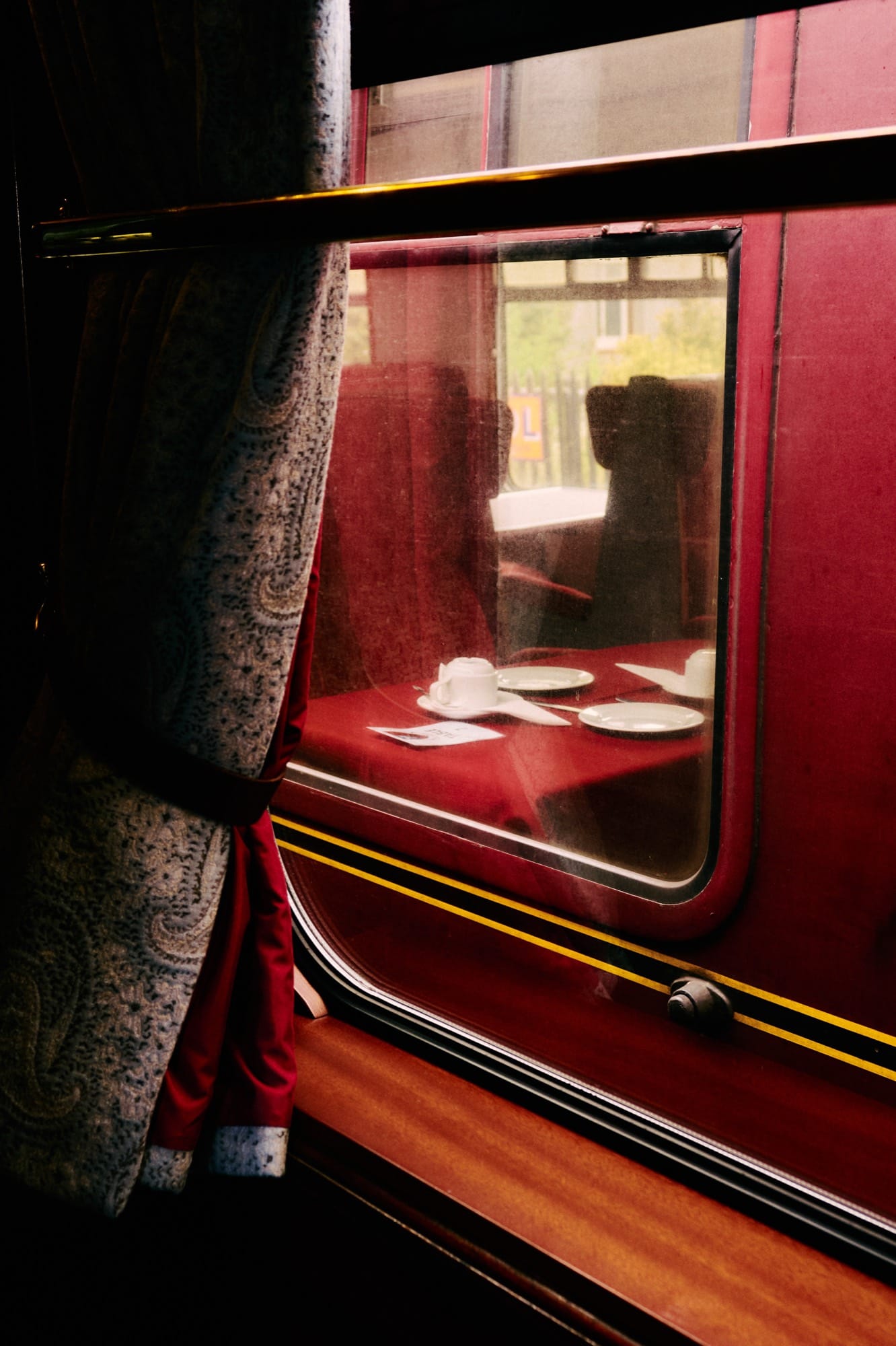 Royal Scotsman crossing a Highland landscape — Edwardian-era carriages against Scottish countryside.
