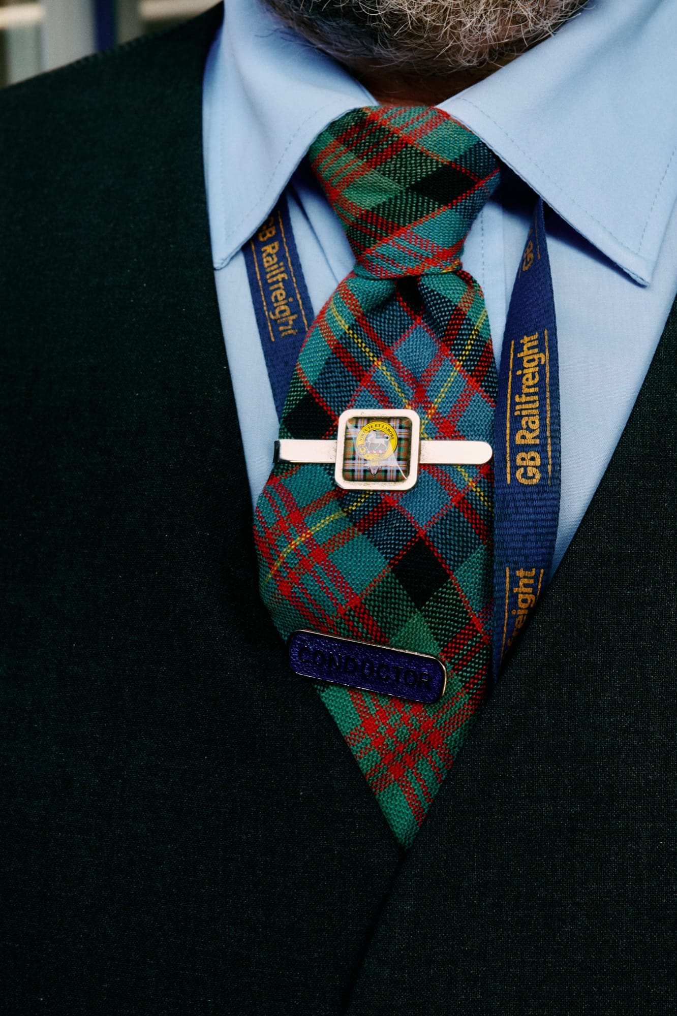 A service moment aboard Royal Scotsman — heritage uniform and the small-train staff-to-guest ratio in practice.