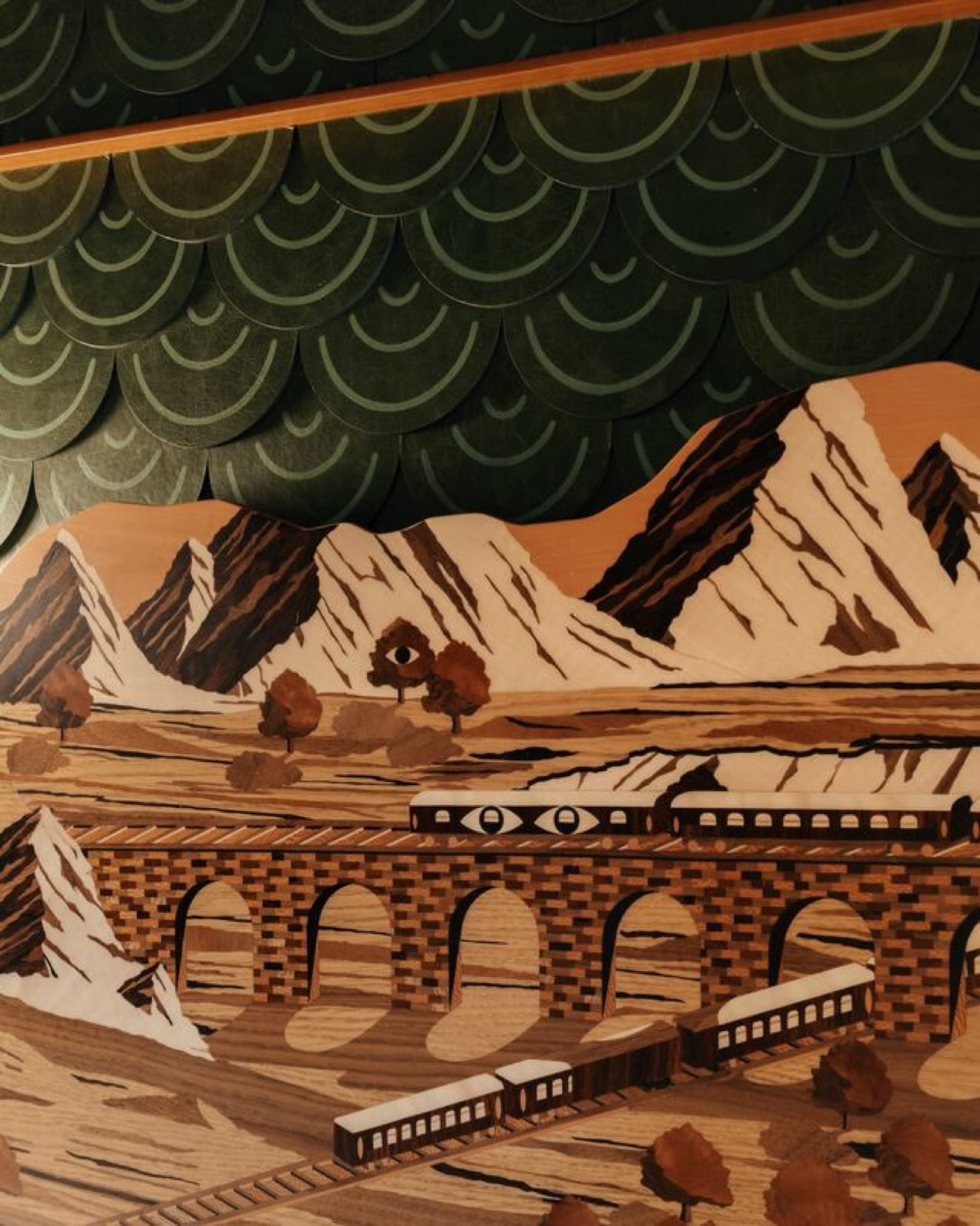 An Art Deco corridor aboard the Venice Simplon-Orient-Express, vintage lamps and original marquetry running the length of the carriage.