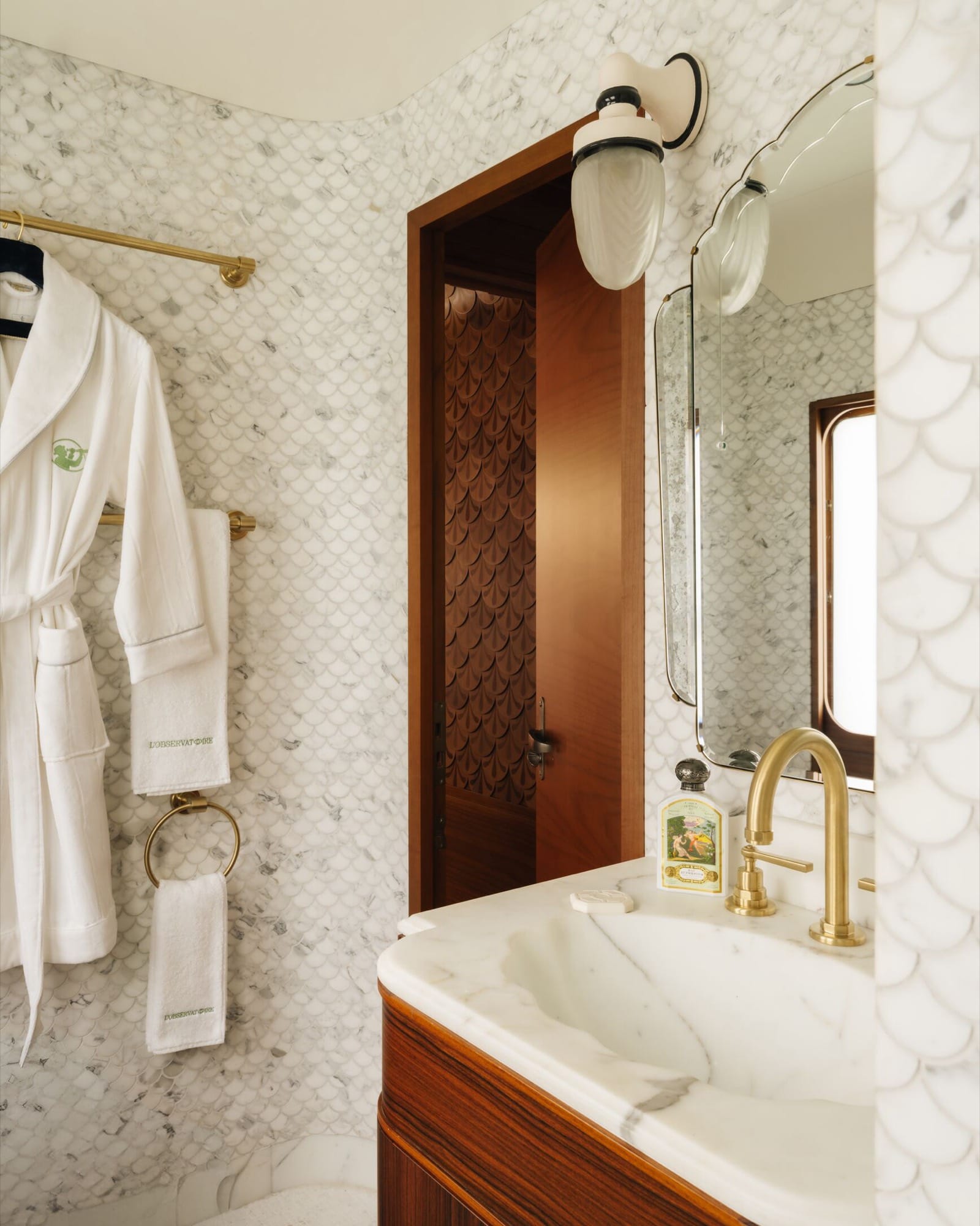 A Historic Cabin aboard the Venice Simplon-Orient-Express — daytime seating that converts to upper and lower berths, original marquetry detailing.