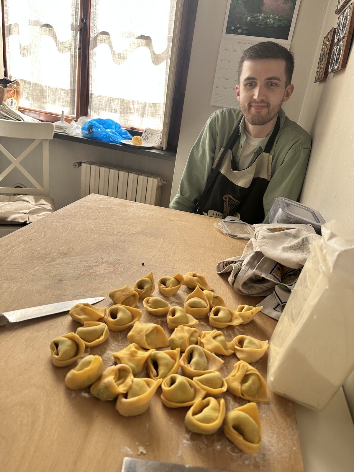 The cooking morning in Florence — produce, pasta, and a long table.