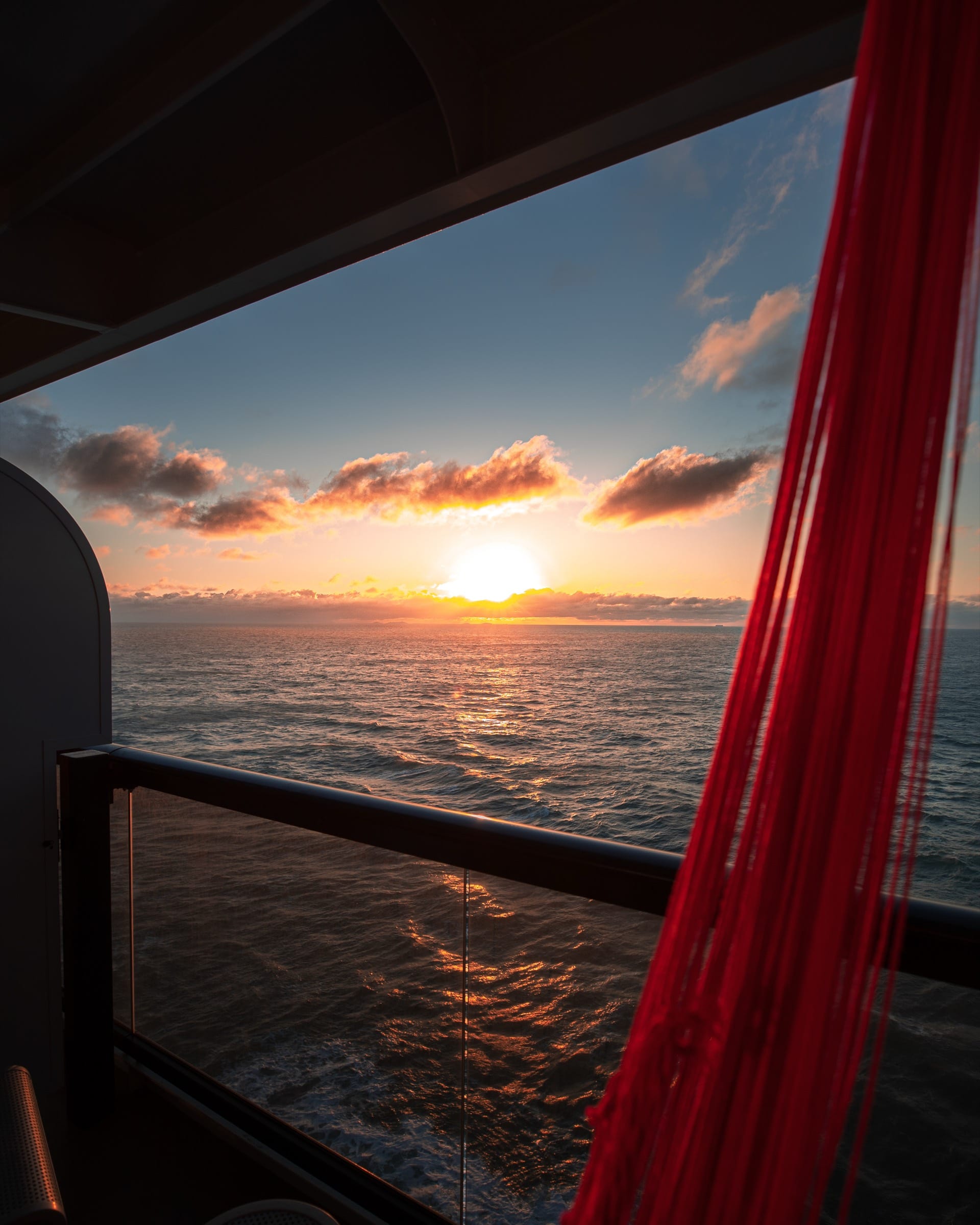 Scarlet Lady Sea Terrace balcony at sunset.