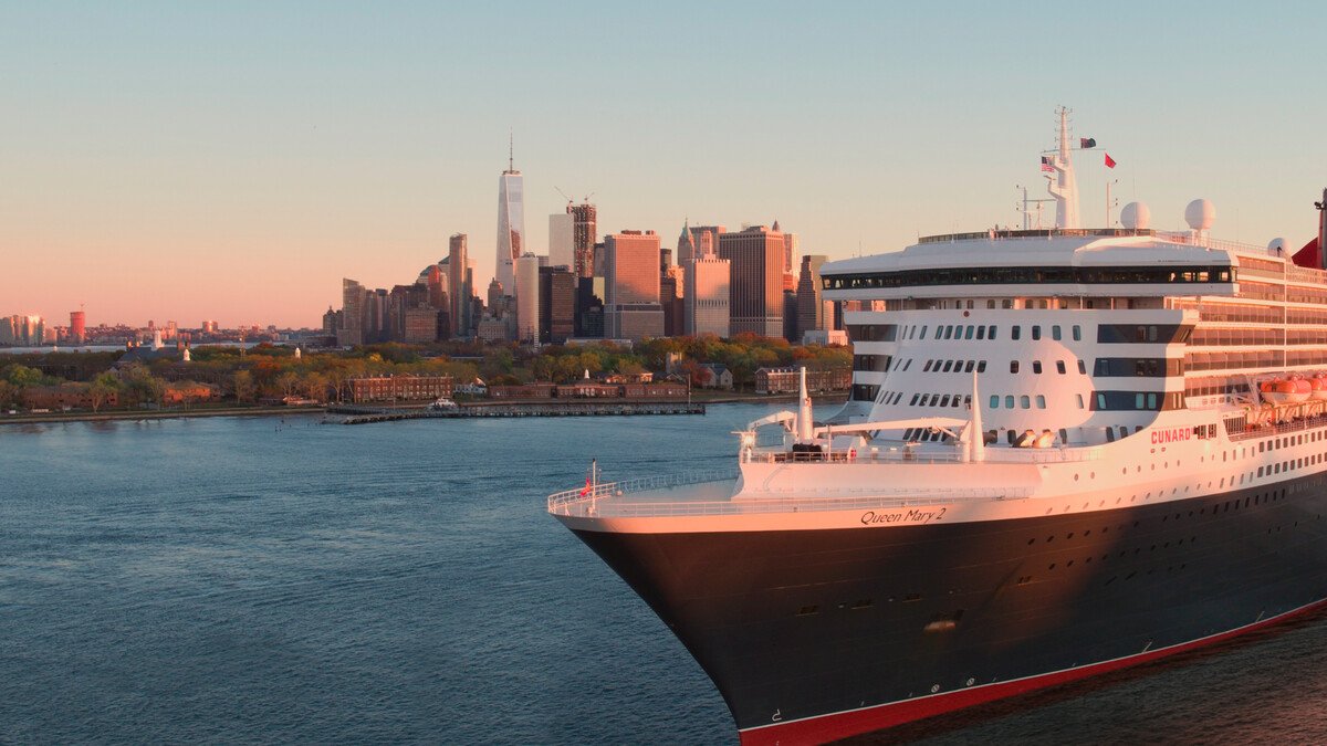 Cunard Queen Mary 2 departing New York at golden hour.