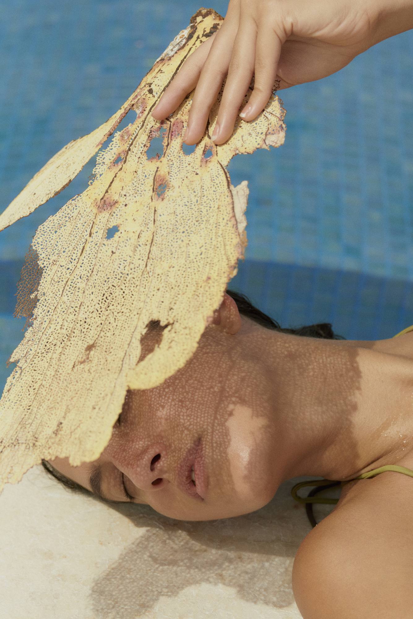 A spa treatment in progress at Cap Juluca, a natural sponge resting against the skin.