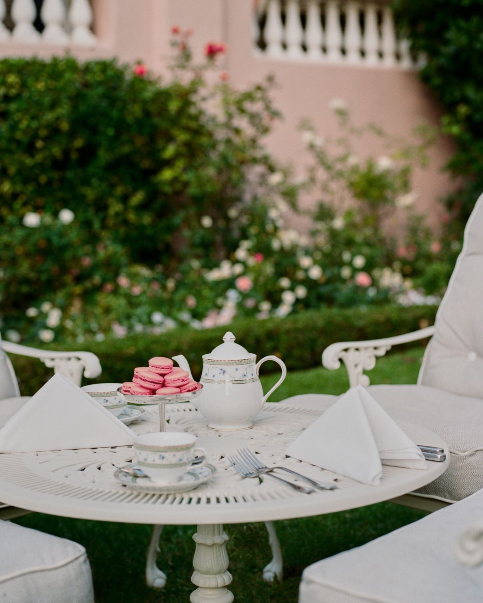 A close-up of the Mount Nelson afternoon tea — small pastries, scones, finger sandwiches set on a tiered stand.