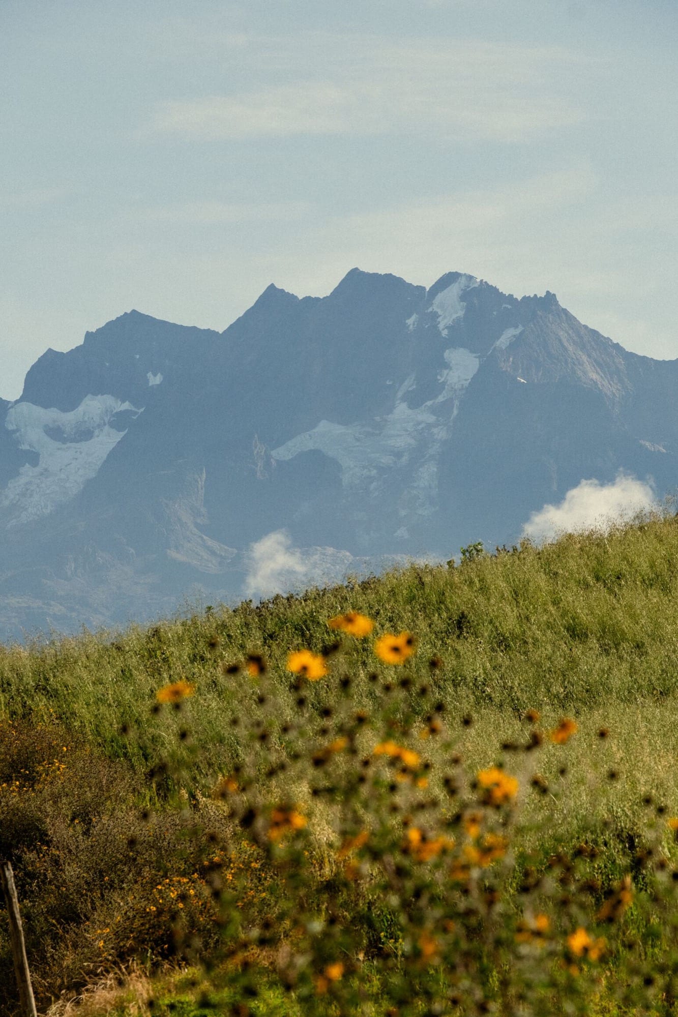 The Andes rising above the Sacred Valley, the property's grounds in the foreground.
