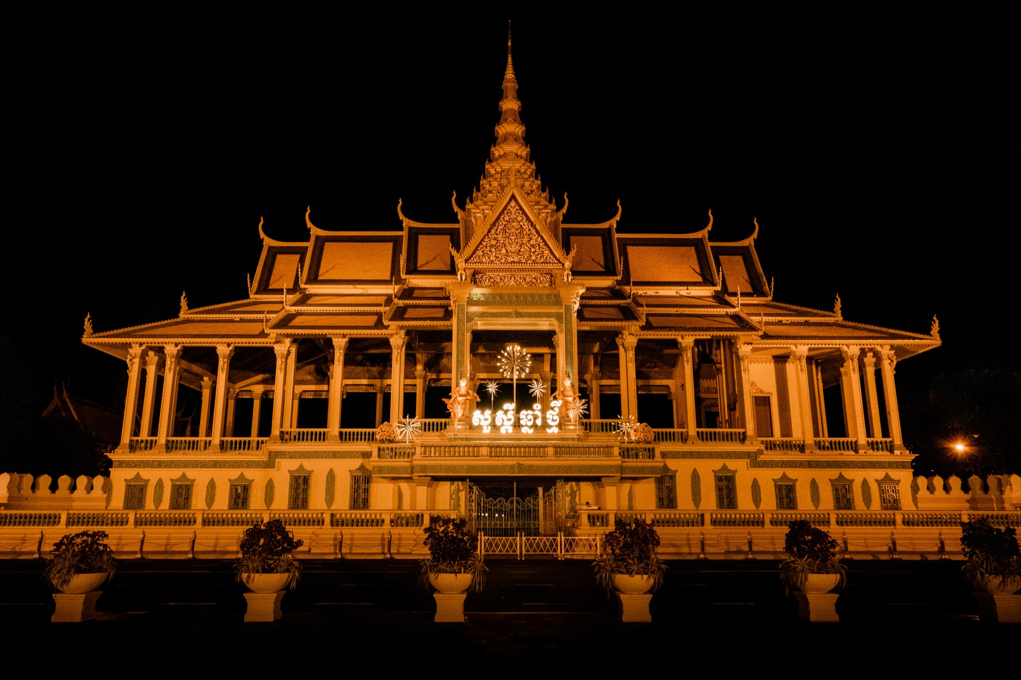 The illuminated golden pavilion of the Royal Palace in Phnom Penh at night, Cambodia