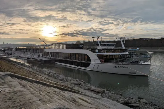 The river ship AmaReina docked on the Danube at sunset.