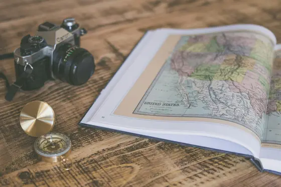 Vintage compass on a folded map.