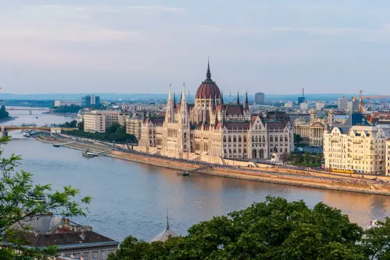 The Hungarian Parliament Building lit along the Danube River in Budapest