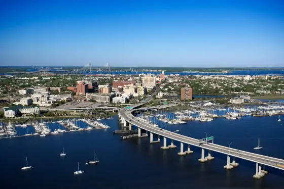 An aerial view of Charleston and its marina with the Arthur Ravenel Jr. Bridge in the distance, South Carolina