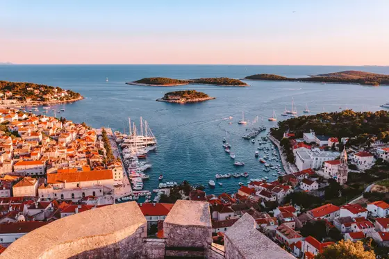 Terracotta-roofed old town above the clear Adriatic on the Dalmatian coast, Croatia