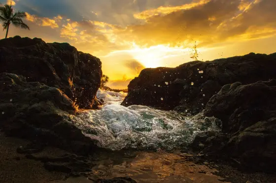 Black volcanic coastline meeting the Pacific on Hawaii's Big Island