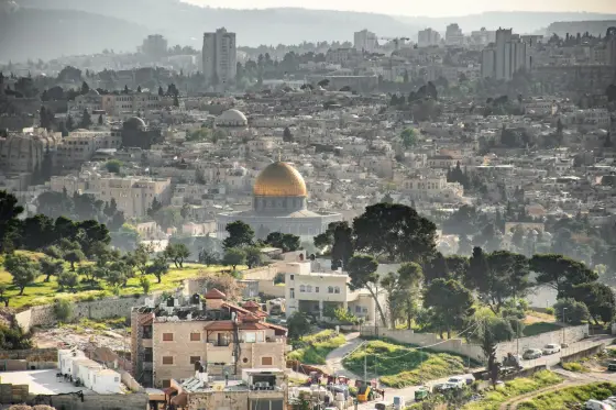 The golden Dome of the Rock above the ancient walls of Jerusalem's Old City