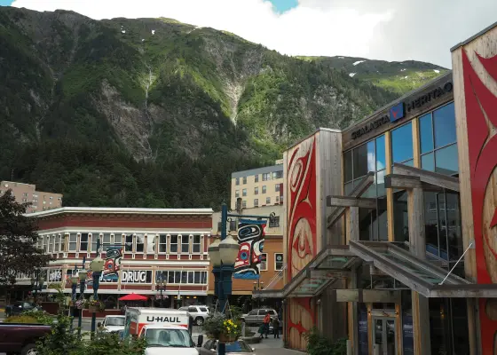 Forested mountains rising steeply above the waterfront of Juneau, Alaska