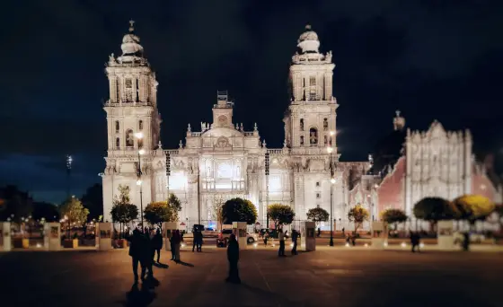 A grand plaza and historic stone buildings in the center of Mexico City