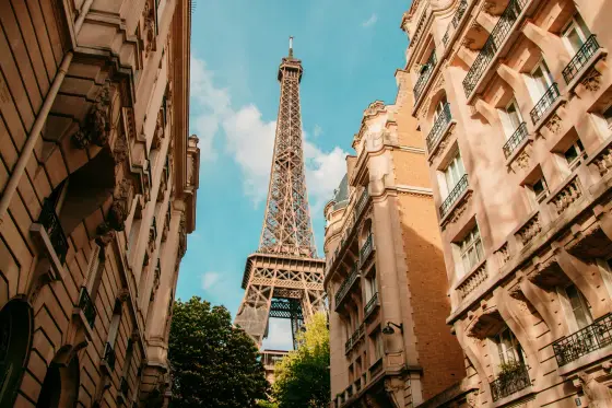 The Eiffel Tower rising above the rooftops of Paris