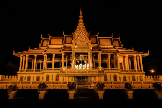 The illuminated golden pavilion of the Royal Palace in Phnom Penh at night, Cambodia