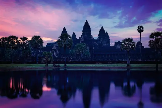 The five towers of Angkor Wat reflected in the lily pond at sunrise, Siem Reap, Cambodia