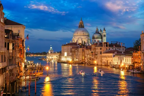 Gondolas and historic palazzos along a canal in Venice, Italy