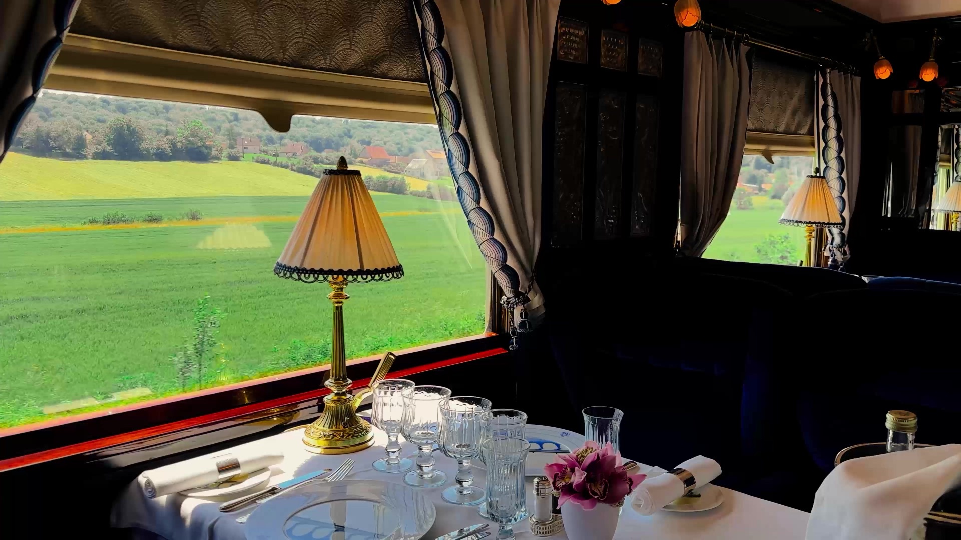 Venice Simplon-Orient-Express, A Belmond Train — restored 1920s carriages at a European station.